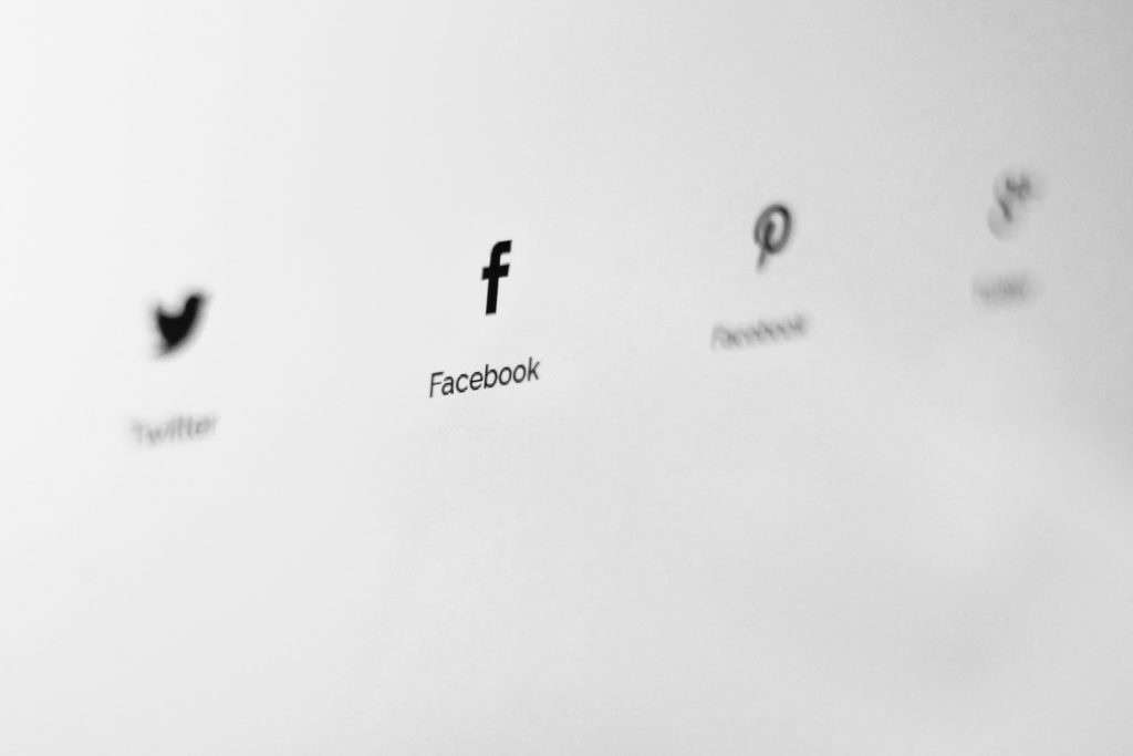 Picture showing Facebook logo amidst other out of focus social media icons